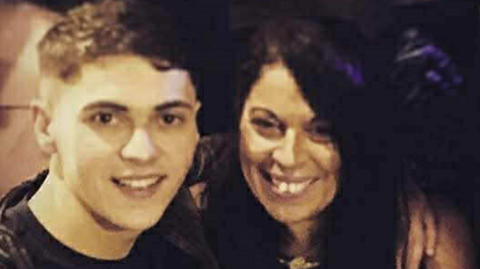 Ben Rafton smiles next to his mum Somaya, the image has a sepia tone to it.