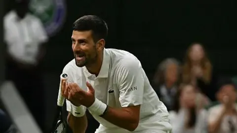 Cameron Norrie hits a forehand