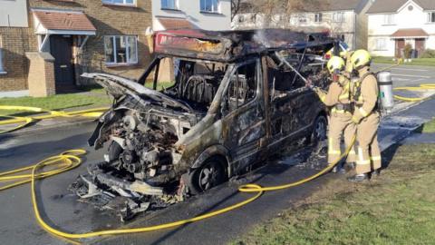 Ice cream van fire being put out