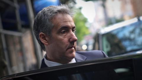 Michael Cohen gets in a car