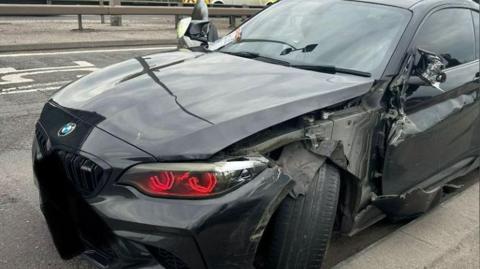 Damaged black BMW