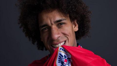 Panama player Adalberto Carrasquilla bites the Panama crest as he poses for a portrait prior to the World Cup