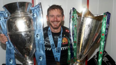 Gareth Steenson poses with the Premiership and Heineken Cup trophies