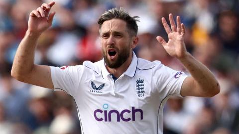 England bowler Chris Woakes reacts while bowling