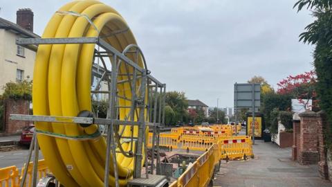 A coiled large yellow gas pipe taken during work on Heavitree Road in Exeter