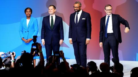 The four Conservative leadership candidates together on stage after delivering their speeches at the Conservative Party conference