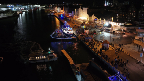 Drone footage of Poole Quay with the candle light lanterns.