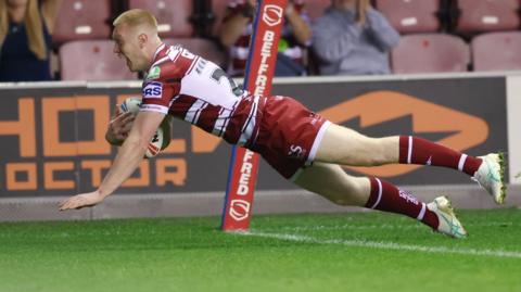 Zach Eckersley scoring a try for Wigan Warriors