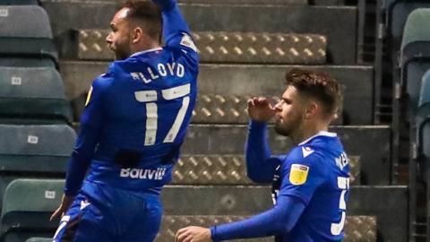 Danny Lloyd celebrates scoring for Gillingham against Crewe