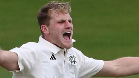 Dillon Pennington celebrates taking a wicket for Nottinghamshire