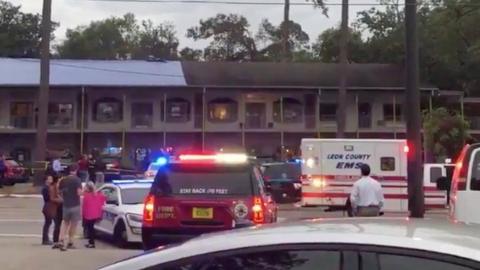 Emergency vehicles are parked outside the Hot Yoga studio at a shopping center where a guman opened fire in Tallahasee, Florida, U.S., November 2, 2018,