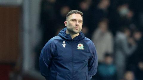 John Eustace watching his Blackburn team play Portsmouth 