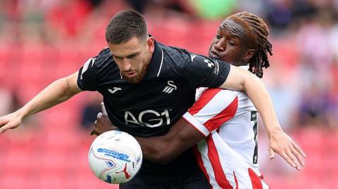 Zan Vipotnik holds up the ball against Stoke City in the Championship