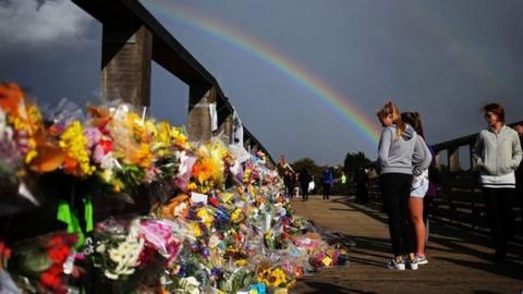 Floral tributes on a bridge near the A27