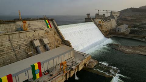 Large dam with water flowing in ethiopia.