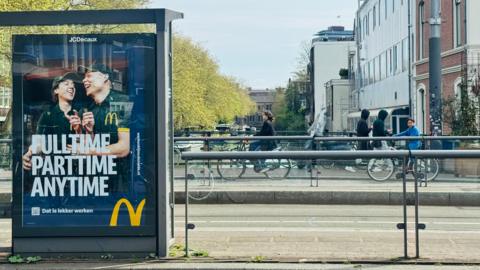 An advert for McDonald's on a bridge in the centre of Amsterdam