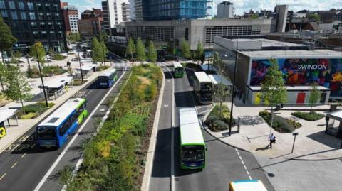 An artist's impression of the planned works, with buses going along two roads in both directions between high rises in a city.