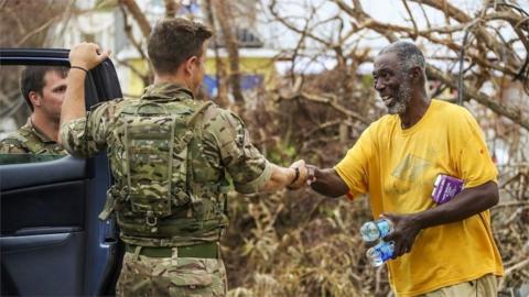 British Army troops shaking hands with a resident in Tortola, British Virgin Islands