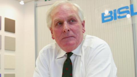 Tony Brown pictured in his business office in 2003