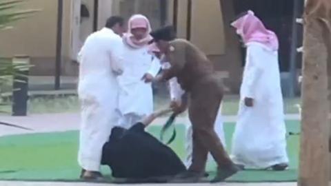 Screengrab of video footage purportedly showing a girl being hit with a belt by a police officer during a raid on an orphanage in Khamis Mushait (30 August 2022)
