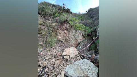 Ladye Bay beach landslide showing fallen rocks in the foreground