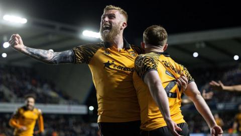 Oli McBurnie celebrates with Hull goalscorer Joe Gelhardt