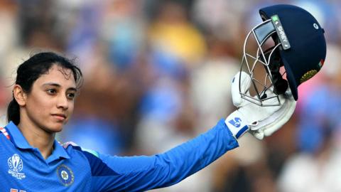 India's Smriti Mandhana celebrates after scoring a century (100 runs) during the ICC Women's Cricket World Cup 2025 one-day international (ODI) match between India and New Zealand at the DY Patil Stadium in Navi Mumbai on October 23, 2025
