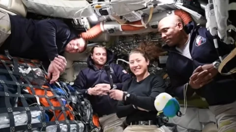 The astronauts inside the capsule.