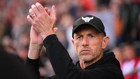 Gary Rowett claps his hands at fans