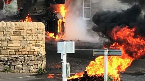 Eight properties are evacuated close to where a mobile crane exploded in Northumberland.