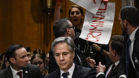 An anti-war protester interrupts Antony Blinken's testimony