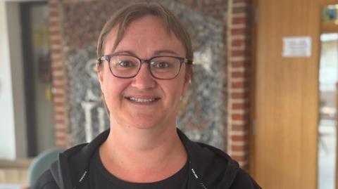 A head and shoulders image of Laura Brockwell. She is wearing glasses and looking into the camera.