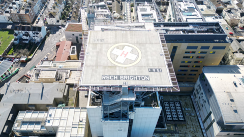 Aerial drone image of the helipad atop a hospital.