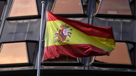 Spain's flag outside a court