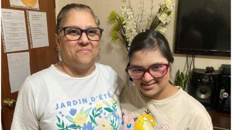 Mum, Maria Dias stood with 18year old daughter, Hannah Dias who has Down's Syndrome