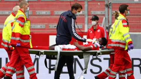 Taiwo Awoniyi is carried off on a stretcher