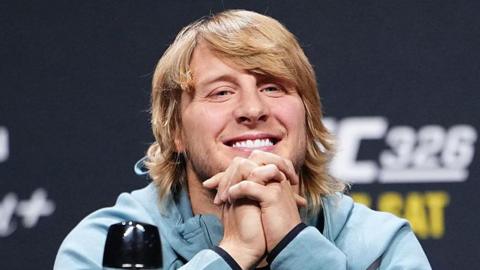 Paddy Pimblett grins during a news conference
