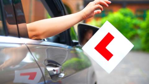 Driver throwing learner plate out window