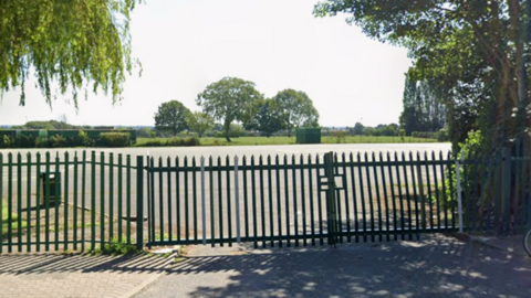 A car park behind a set of gates in Leicester