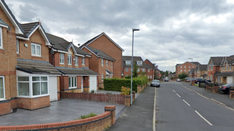 A view down Ainsbrook Avenue in Charlestown