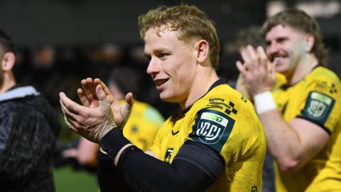 David Richards applauds the Dragons supporters after victory against Scarlets