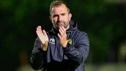 Torquay United Football Club manager Paul Wotton claps his hands together at the National League South match against Hampton & Richmond