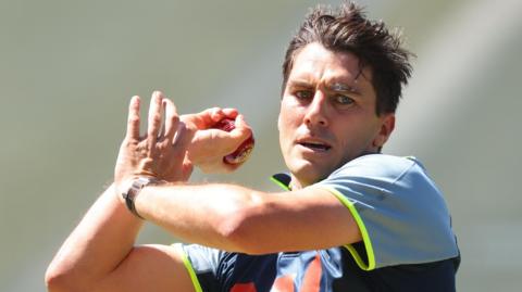 Pat Cummins bowling in the nets in Australia training kit