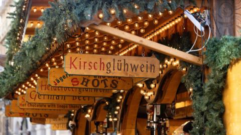 Stalls at a Christmas market selling German alcoholic products.