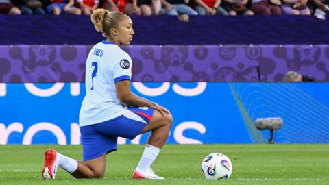 England forward Lauren James takes the knee before the France game