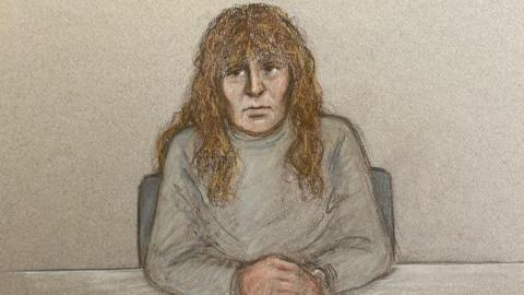 An artist's impression by Julia Quentzler shows Nancy Pexton is a grey polo neck long sleeved top sitting at a table with a grey background behind her.