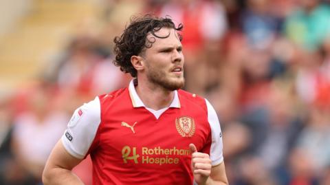 Thomas Holmes playing for Rotherham against Exeter