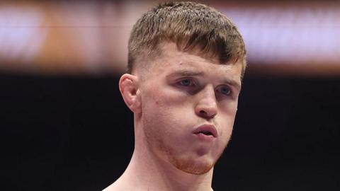 Paul Hughes puffs out his cheeks