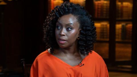 A close-up shot of Chimamanda Ngozi Adichie talking 