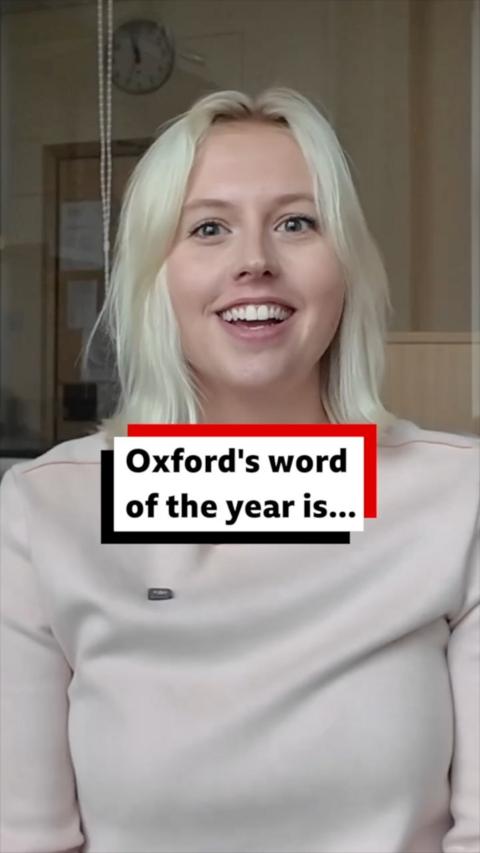 Woman with short blonde hair smiles at the camera.